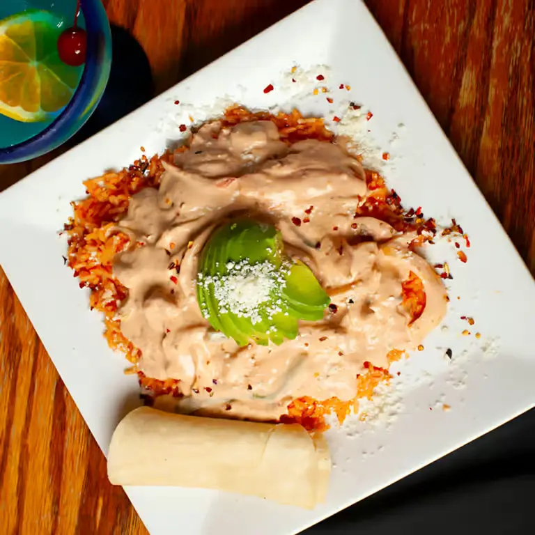 Mexican entrée served with rice and avocado